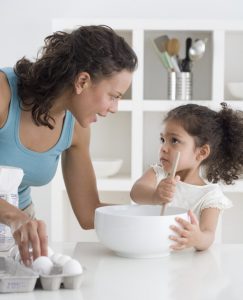 Mother and Daughter Baking Together --- Image by © Royalty-Free/Corbis