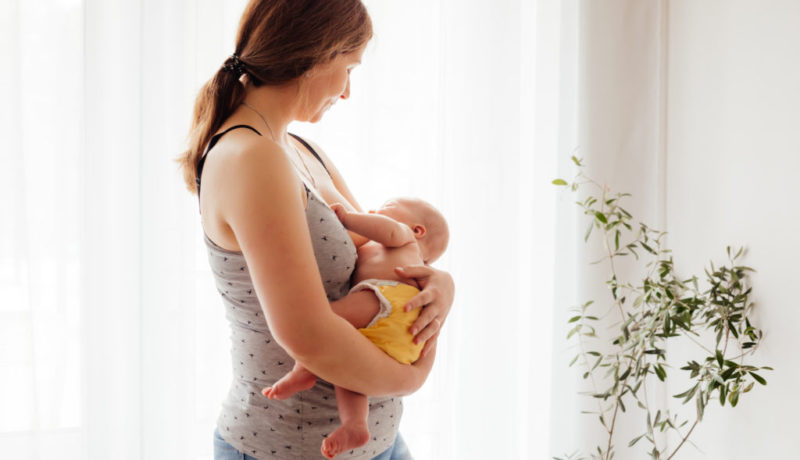 Woman in postpartum depression feeling unemotional and exhausted
