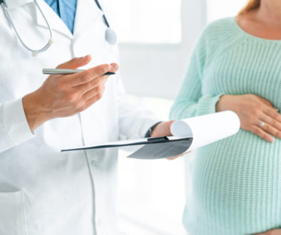 Cropped image of pregnant woman visiting doctor